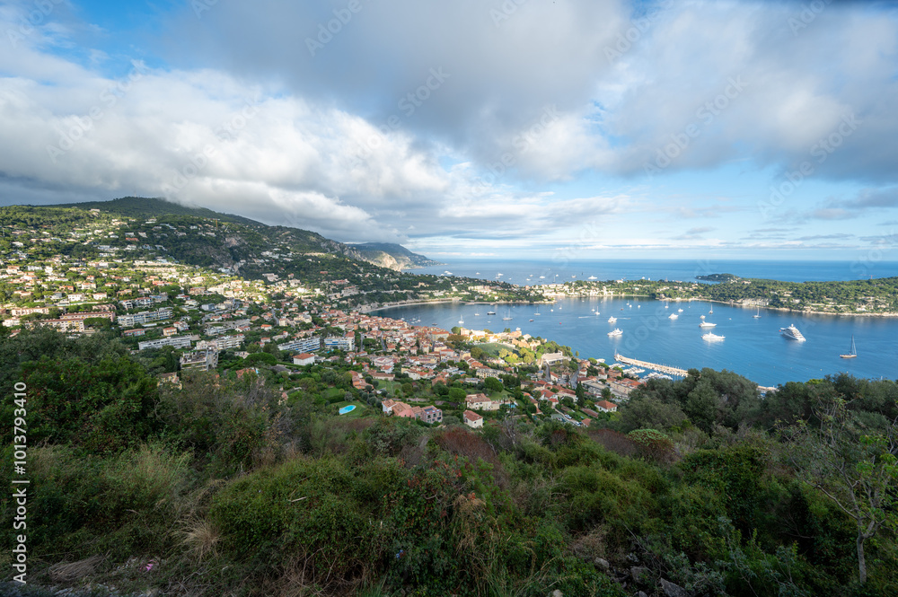 Yachts at anchor in natural harbor of Villefranche-sur-Mer on sunny summer afternoon. Yachts at anchor in natural harbor of Villefranche-sur-Mer on sunny summer afternoon.