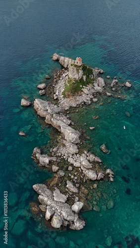 Church on a rock island rising above the sea, photo above. The stones protruding above the water are shaped like a snake.
