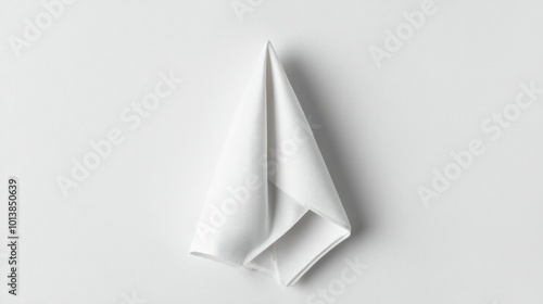 Wallpaper Mural A single white napkin elegantly folded into a triangle on a white background, creating a clean and simple presentation. Torontodigital.ca