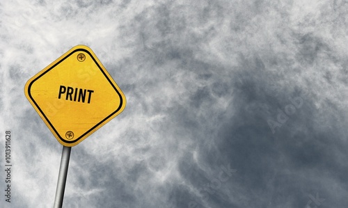 Print, yellow sign with cloudy sky