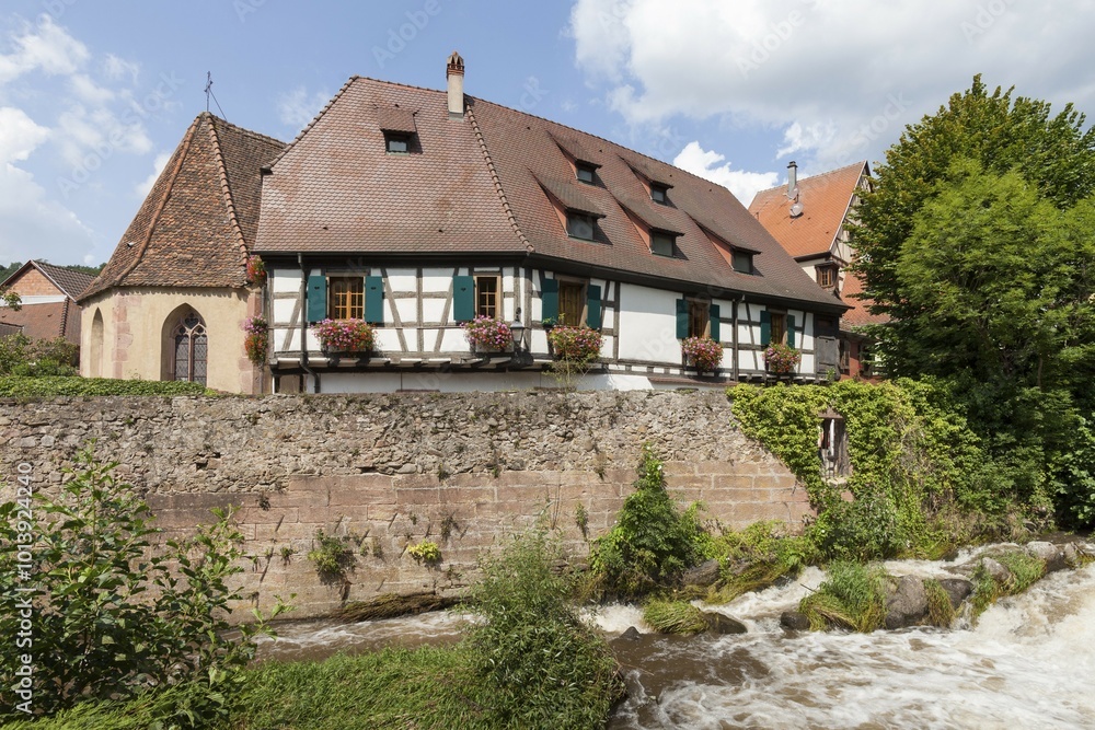 Oberhof Chapel and half-timbered houses on the river Weiss, Kaysersberg, Alsace, France, Europe Oberhof Chapel and half-timbered houses on the river Weiss, Kaysersberg, Alsace, France, Europe