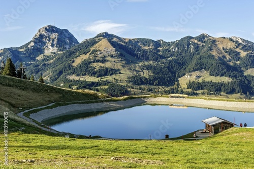 Water reservoir for artificial snow, pond, Walleralm, Mount Wendelstein at back, Mangfall mountains, Alpine foothills, Upper Bavaria, Bavaria, Germany, Europe photo