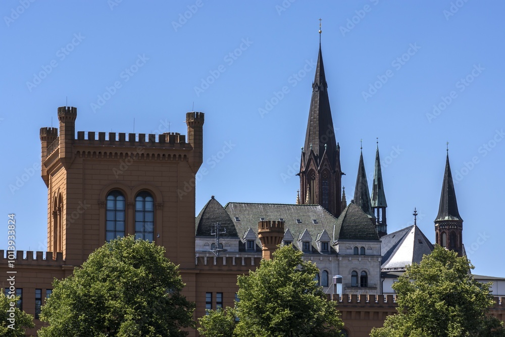 Fototapeta premium Towers of the neo-Gothic St. Paul's Church, left tower of the Ministry of the Interior, Schwerin, Mecklenburg-Western Pomerania, Germany, Europe