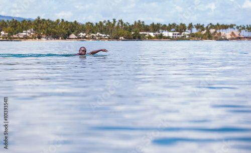 Black Man Swimming in Tropical Resort Waters