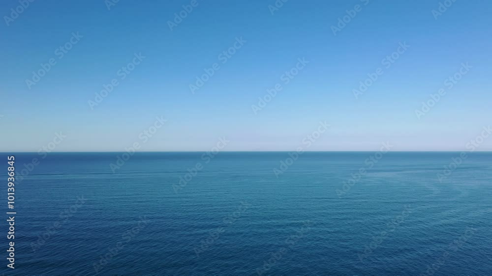 Ocean seascape view from above. Drone recording of a very calm sea and blue sky. Ocean seascape view from above. Drone recording of a very calm sea and blue sky.