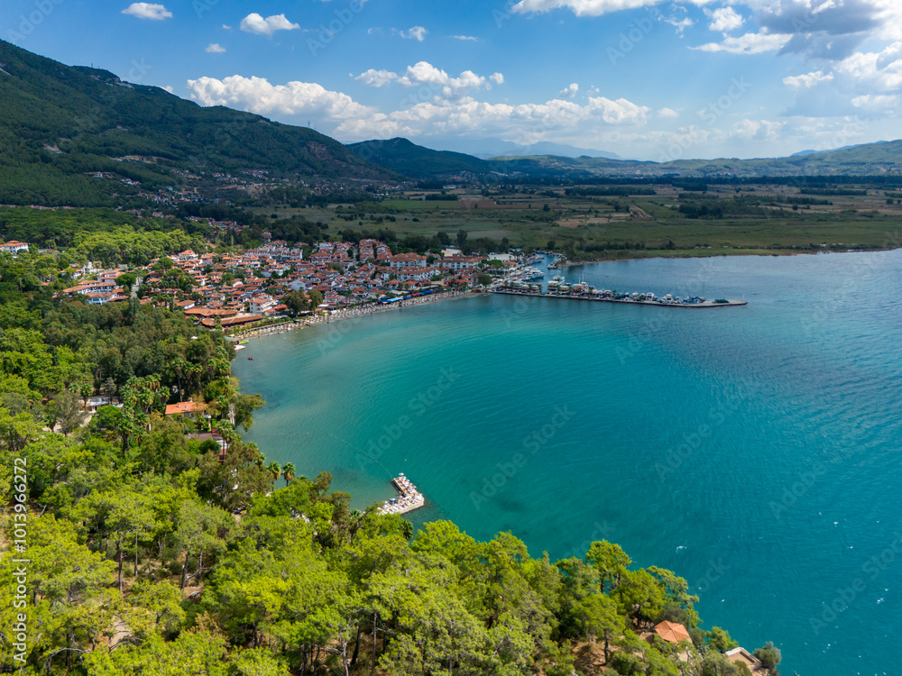 Naklejka premium Akyaka District in Ula, Mugla, Turkey. Aerial view of Akyaka. Akyaka is situated at the Gulf of Gokova. Beautiful Beach and Coast View.