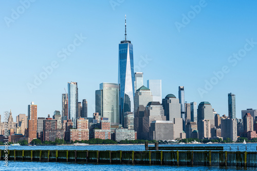 View of the Manhattan skyline from Hoboken, New Jersey, set against a clear blue sky. 