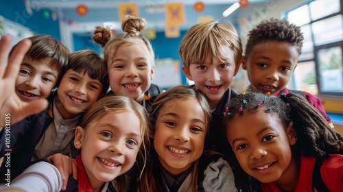  Happy group of diverse school children smiling for a group selfie in a colorful classroom setting