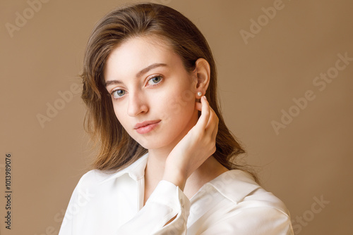 Beautiful young girl with jewelry. Studio portrait