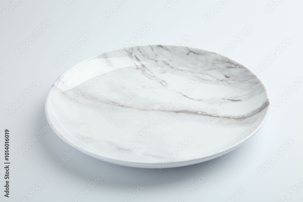One empty ceramic plate isolated on white One empty ceramic plate isolated on white