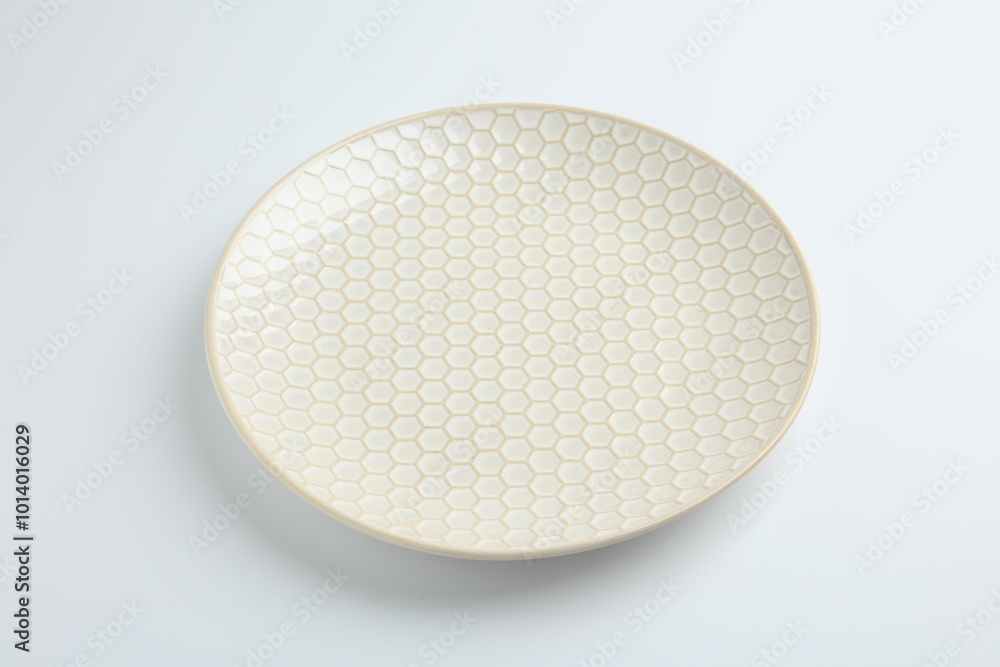 One empty ceramic plate isolated on white One empty ceramic plate isolated on white