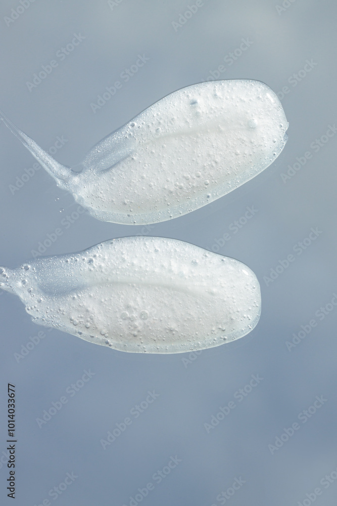 close-up of cream on a blue sky with clouds background, cosmetics beauty product texture, shampoo, soap close-up of cream on a blue sky with clouds background, cosmetics beauty product texture, shampoo, soap