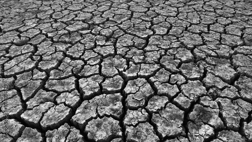 Obraz na płótnie broken and cracked lands caused by drought, lands split open by thirst, w salonie