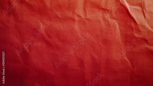 Sheet of red paper texture background, showcasing a smooth, vibrant red surface with subtle tonal variations photo