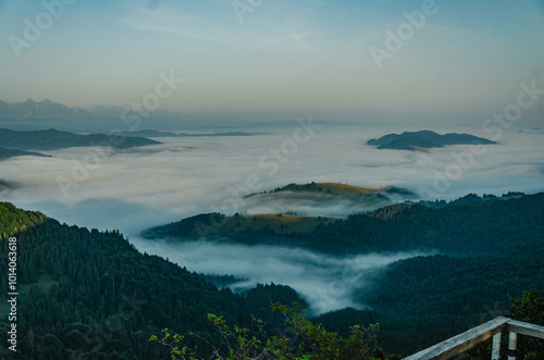 Mountain Peaks Above the Clouds at Dawn photo