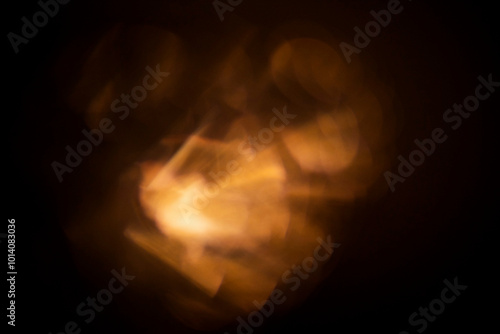 Wallpaper Mural Abstract light shapes on dark background in warm orange color. Background for design and special effects. Torontodigital.ca