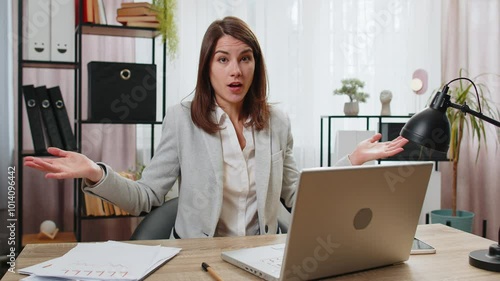 I don't know what to say. Confused businesswoman working on laptop at home office desk. Freelancer feeling embarrassed about ambiguous question having doubts, no answer idea, being clueless, uncertain