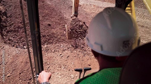 Slow motion video of an excavator being used in a construction project