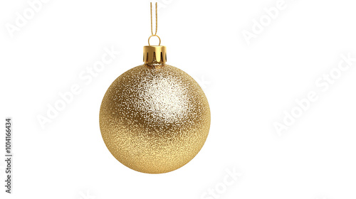 A gold ornament hanging from a string