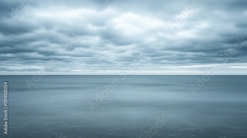 Serene Ocean Horizon with Gathering Storms, a tranquil seascape showcasing minimalist beauty and the contrast of calm waters and dark clouds