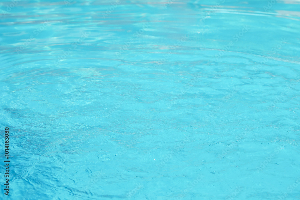 Clear water in outdoor swimming pool on sunny day Clear water in outdoor swimming pool on sunny day