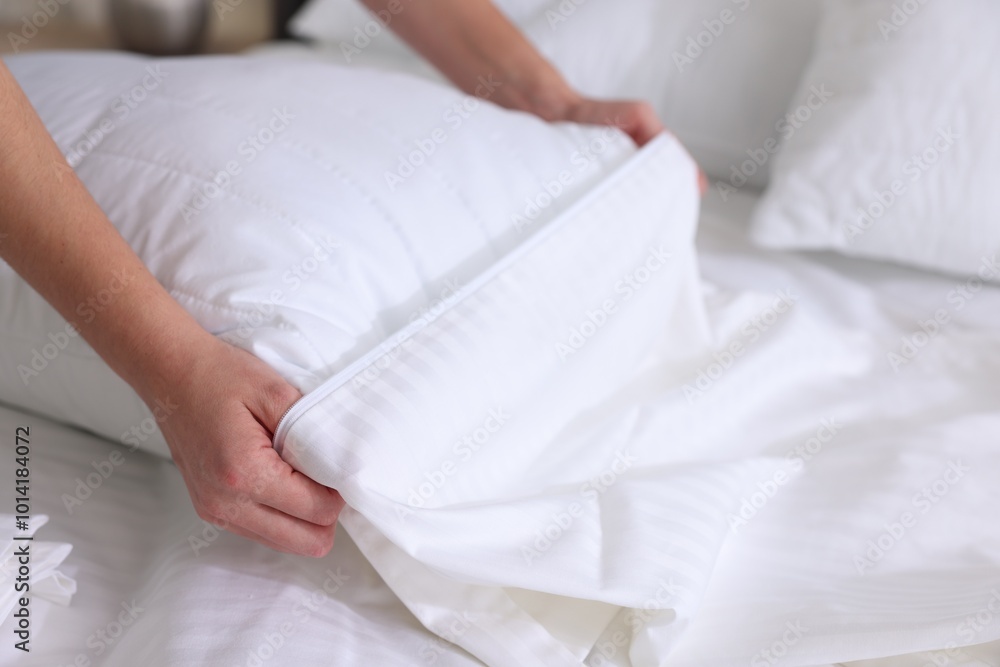 Woman changing clean bed linens at home, closeup Woman changing clean bed linens at home, closeup