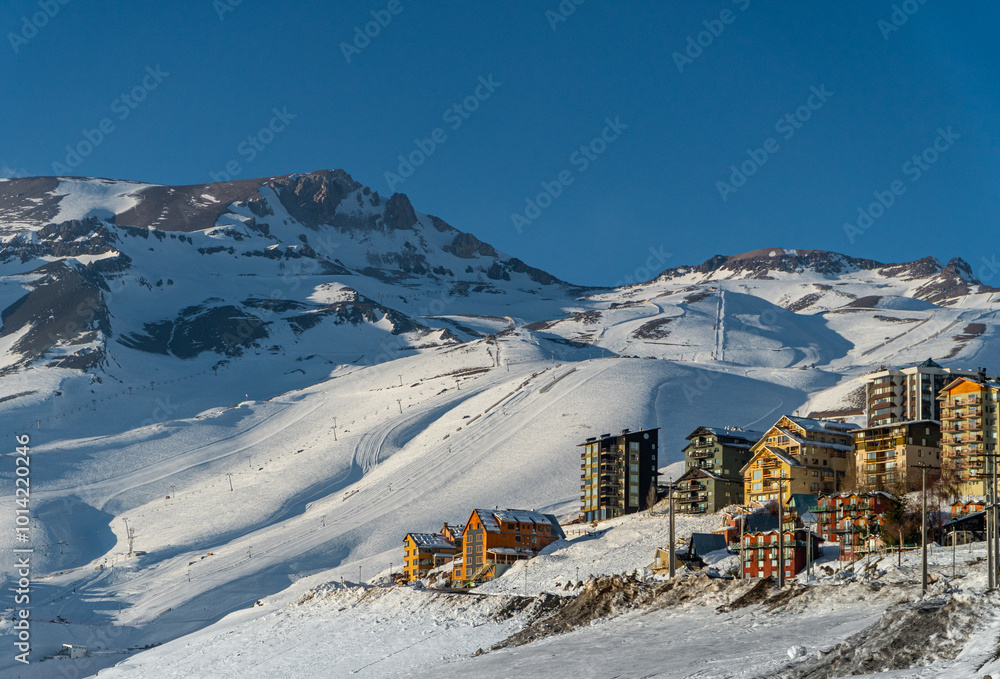 El Colorado Ski Resort, Farellones Chile: Distant View of Colorful Cabins Amid Snowy Mountains