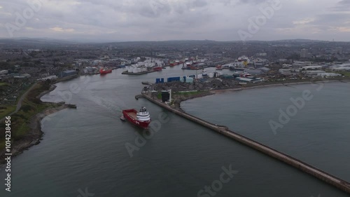 Aerial view of ship leaving Aberdeen harbour, city in scotland.