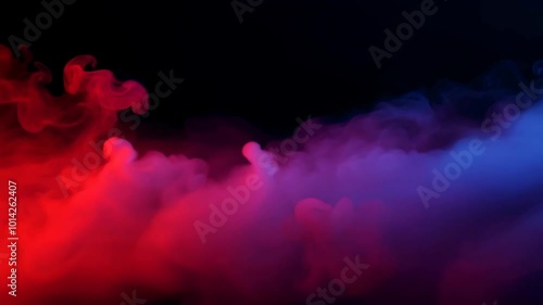 A mesmerizing cloud of mist swirls in rich red and blue hues against a black backdrop creating an abstract, moody, and ethereal atmosphere.