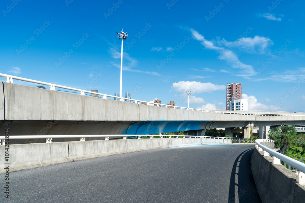 Fotografie Highway and viaduct under the blue clouds