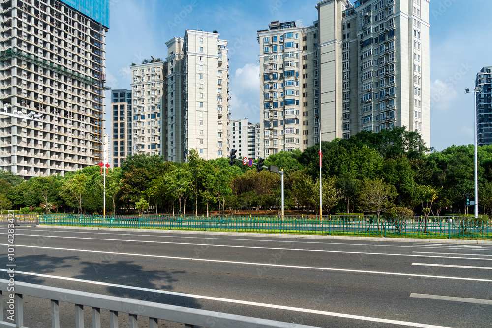 Empty urban road and buildings in the city Empty urban road and buildings in the city