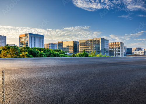 Obraz na płótnie Asphalt road with modern city buildings scenery at sunset. car advertising background. w salonie