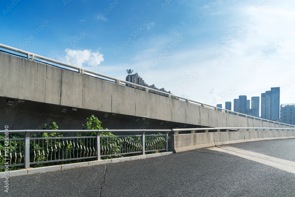 Concrete structure and asphalt road space under the overpass in the city Concrete structure and asphalt road space under the overpass in the city