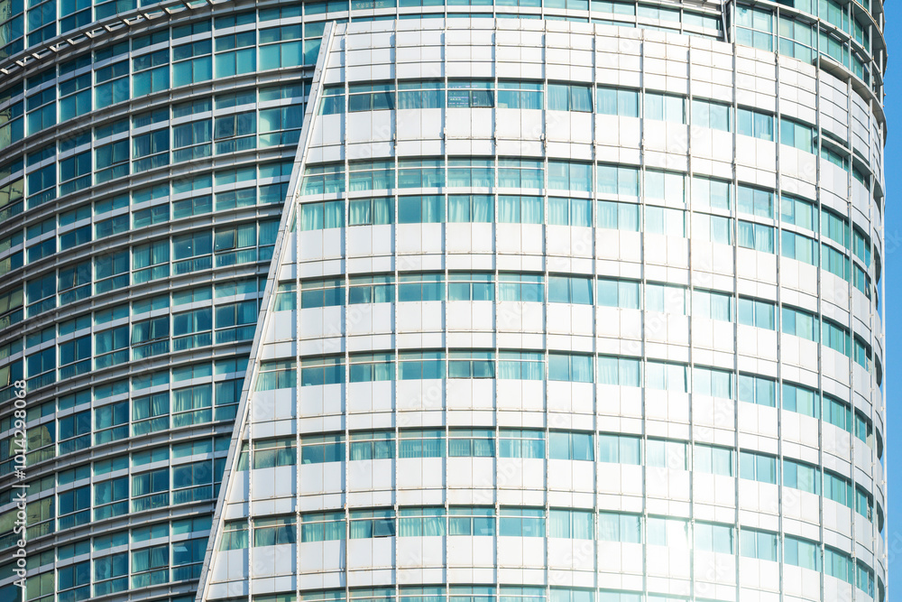 A beautiful background of an glass office building, reflecting clouds in the opened windows A beautiful background of an glass office building, reflecting clouds in the opened windows