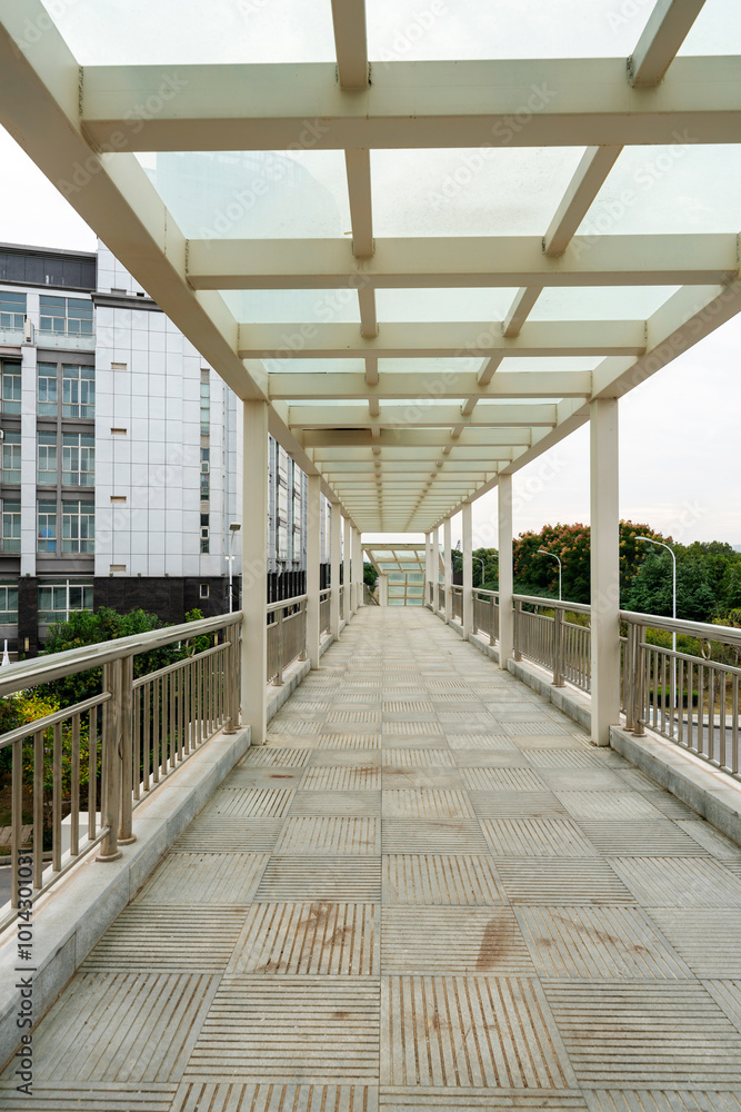 Inside of a modern overhead pedestrian bridge Inside of a modern overhead pedestrian bridge