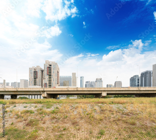 Highway overpass modern city skyline background