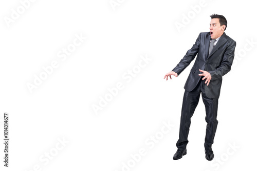 Scared man in suit standing in studio