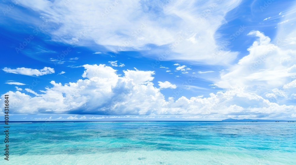 Clear blue sky with white clouds over turquoise ocean. Tropical seascape for travel and nature designs. Clear blue sky with white clouds over turquoise ocean. Tropical seascape for travel and nature designs.
