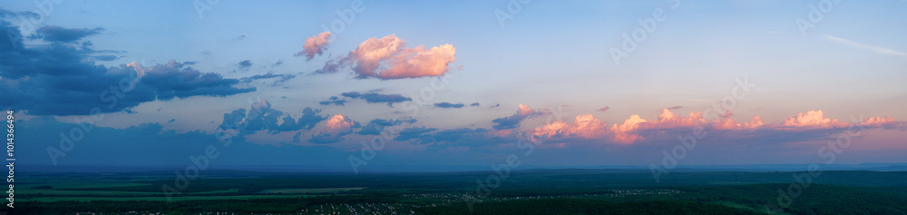 Summer, a panorama of cumulus clouds in the sunset light. Summer, a panorama of cumulus clouds in the sunset light.
