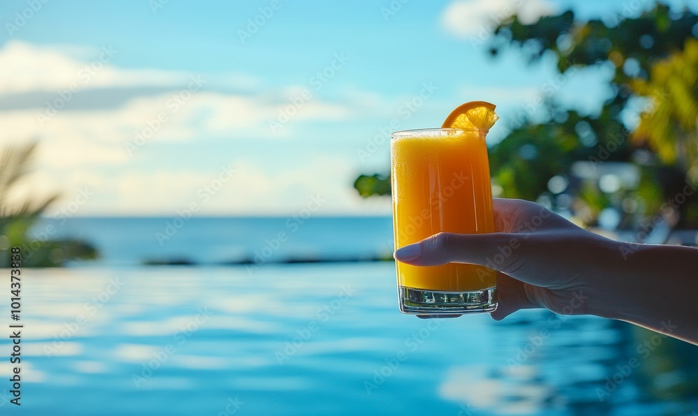 Orange juice in glass, pool, and hand. Orange juice in glass, pool, and hand.