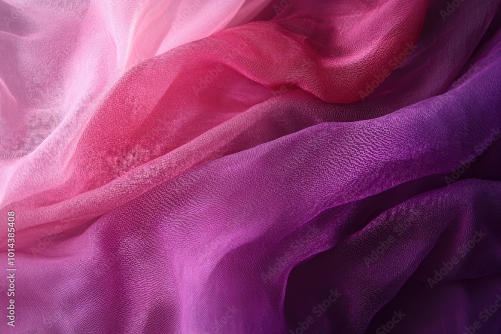 Fototapeta premium Soft and flowing fabric in shades of pink and purple, creating a serene and elegant atmosphere for various creative projects.