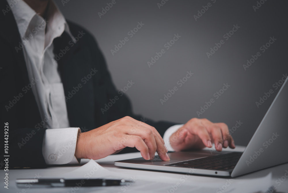 Businessman in a formal suit typing on a laptop, focused and productive at work. Ideal for corporate, entrepreneurship, remote work, Businessman in a formal suit typing on a laptop, focused and productive at work. Ideal for corporate, entrepreneurship, remote work,
