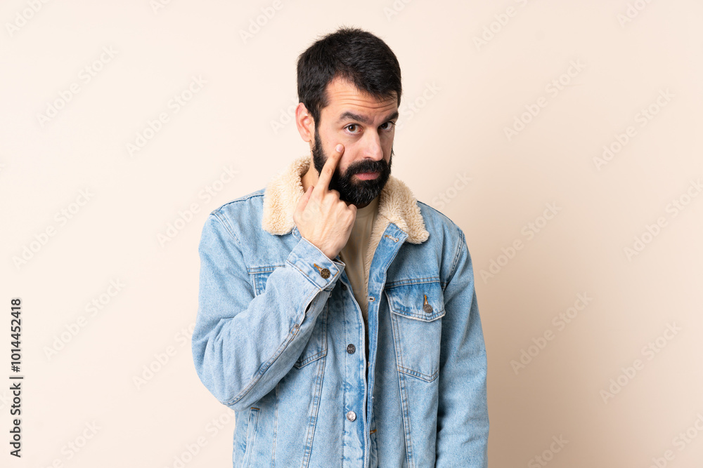 Caucasian man with beard over isolated background showing something Caucasian man with beard over isolated background showing something