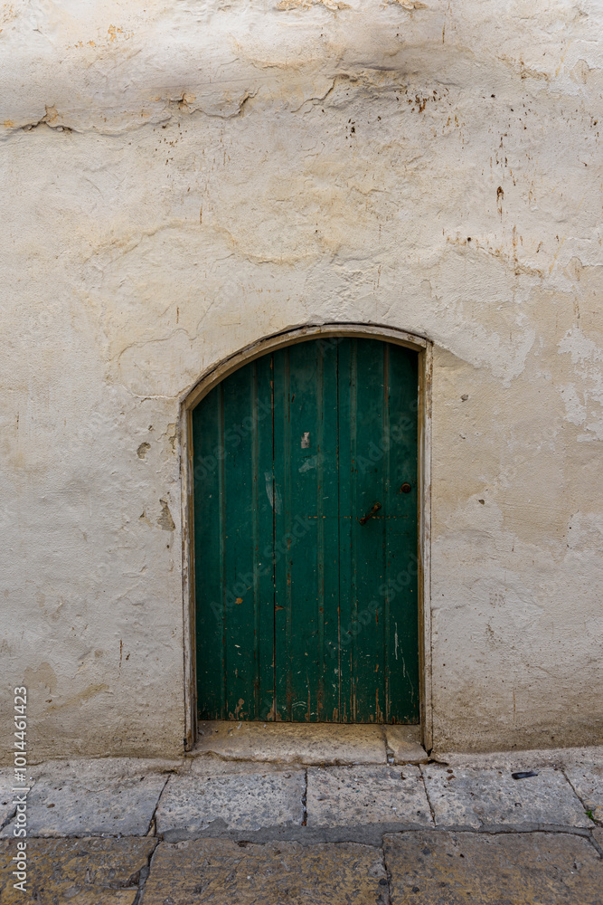 Fototapeta premium Old authentic vintage closed front door in Ostuni, Puglia, Italy