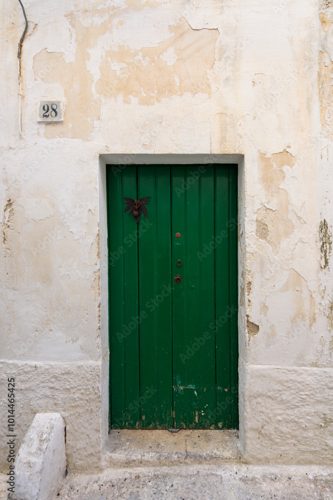 Fototapeta premium Old authentic vintage closed front door in Ostuni, Puglia, Italy
