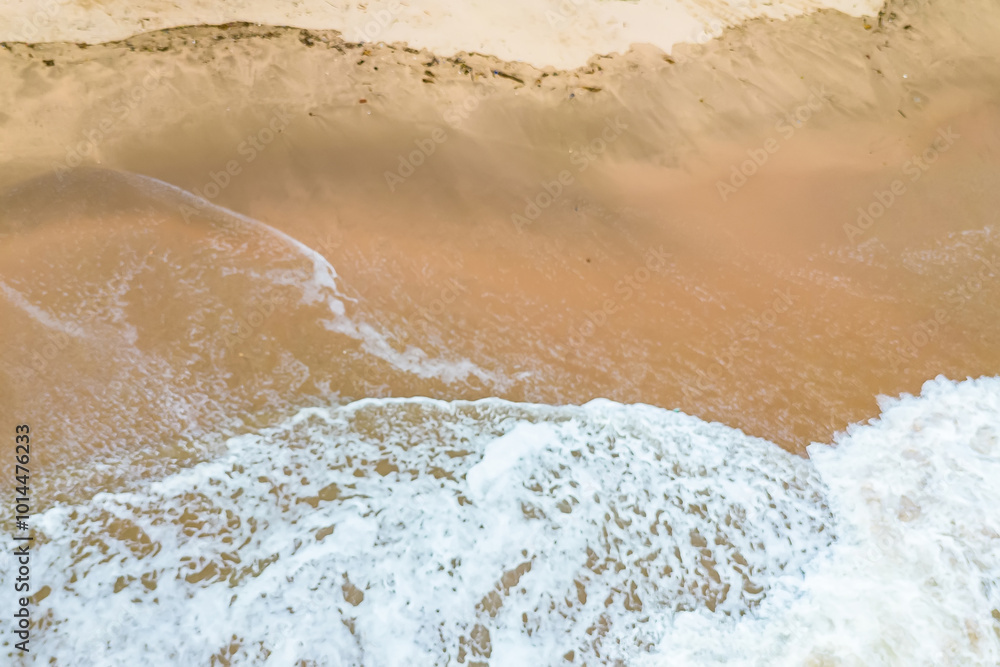 Aerial View of Ocean Waves Crashing on Sandy Beach. Aerial View of Ocean Waves Crashing on Sandy Beach.