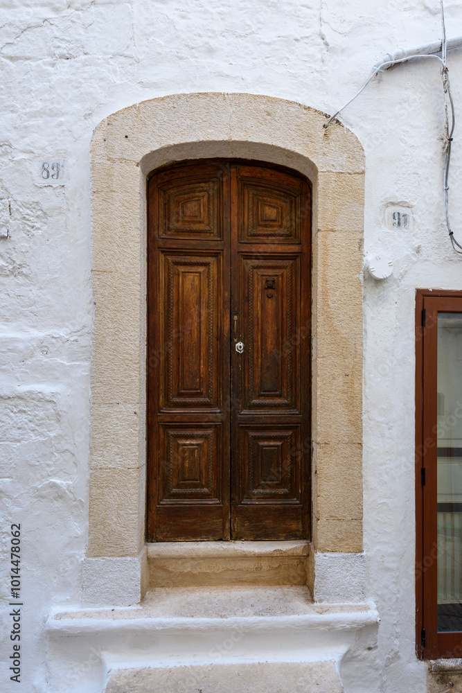 Fototapeta premium Old authentic vintage closed front door in Ostuni, Puglia, Italy