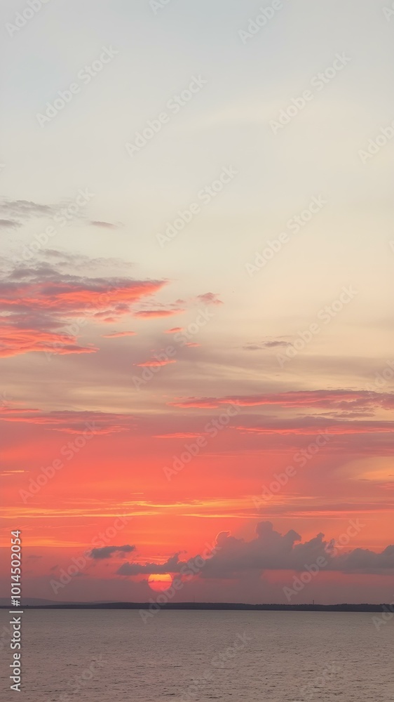 The sky at sunset, with vivid orange and red tones reflecting on the water and distant clouds catching the last rays of the sun
The sky at sunset, with vivid orange and red tones reflecting on the water and distant clouds catching the last rays of the sun