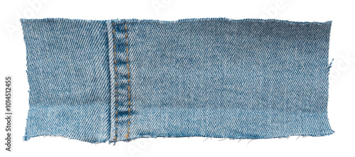 Piece of torn denim on a white background. Denim texture