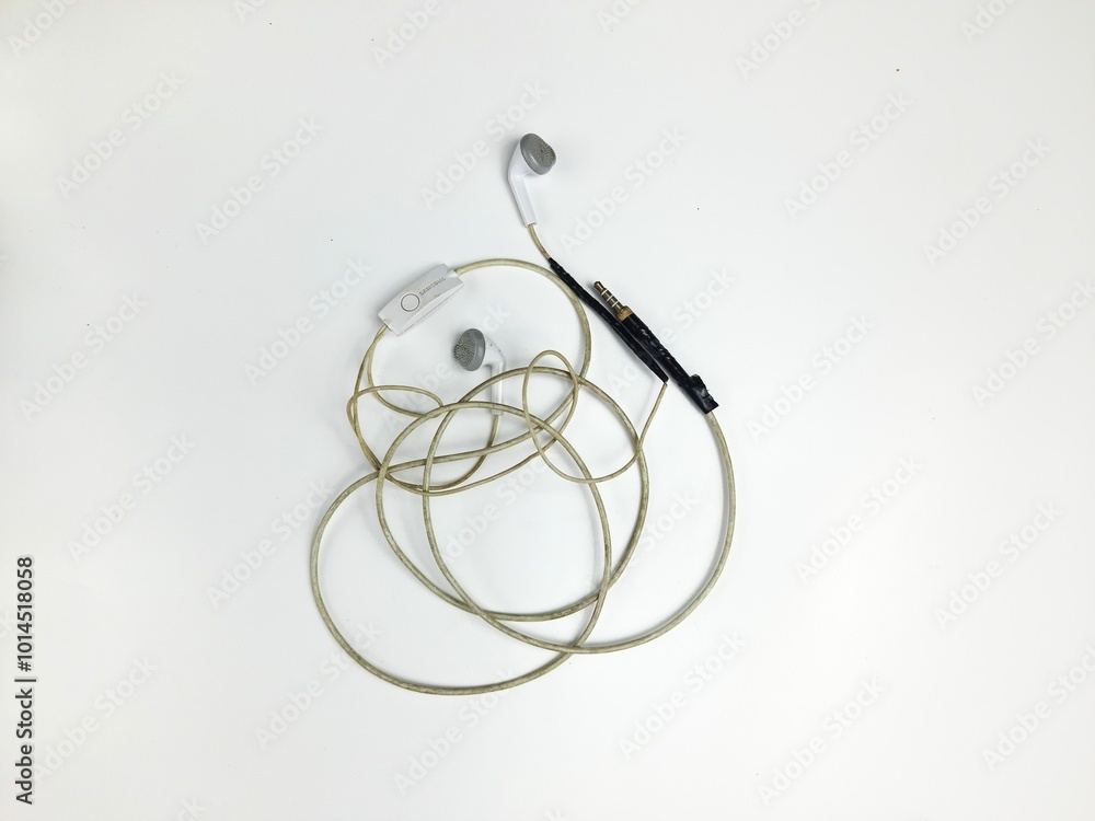 small broken earphone cable. covered with black duct tape. isolated background small broken earphone cable. covered with black duct tape. isolated background